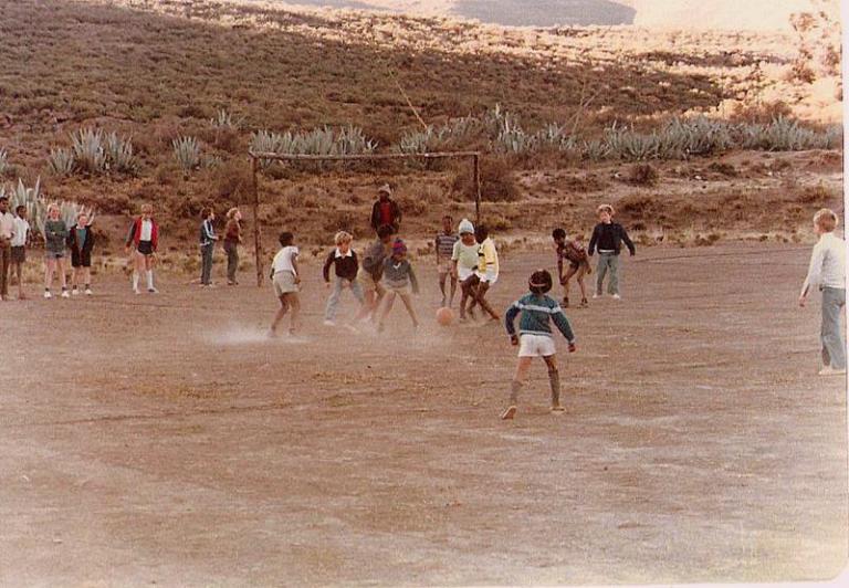 A soccer match with a visiting farm team.